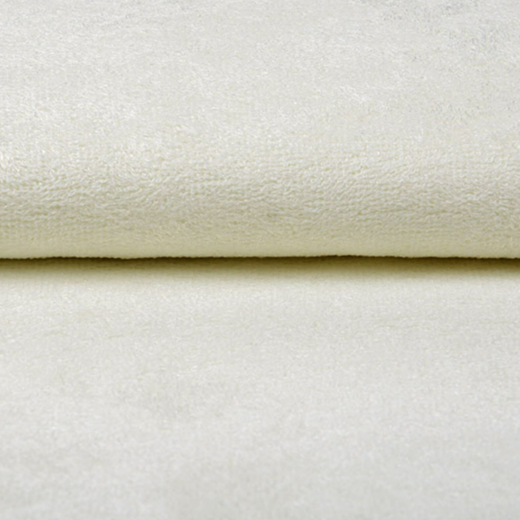 Close-up van de zachte structuur van crème bamboe badstof