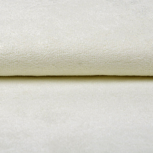 Close-up van de zachte structuur van crème bamboe badstof