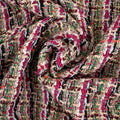 Multicolor bouclé stof met fuchsia, groene en crèmekleurige draden en subtiele glitterdetails
