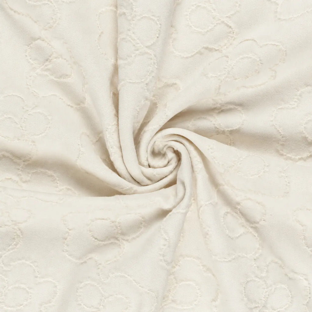 Gedrapeerde heavy knit jacquard in gebroken wit met reliëfmotief