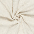 Gedrapeerde heavy knit jacquard in gebroken wit met reliëfmotief