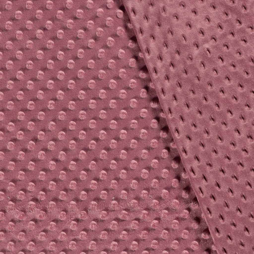 Voor- en achterkant van oudroze minky fleece met stippen