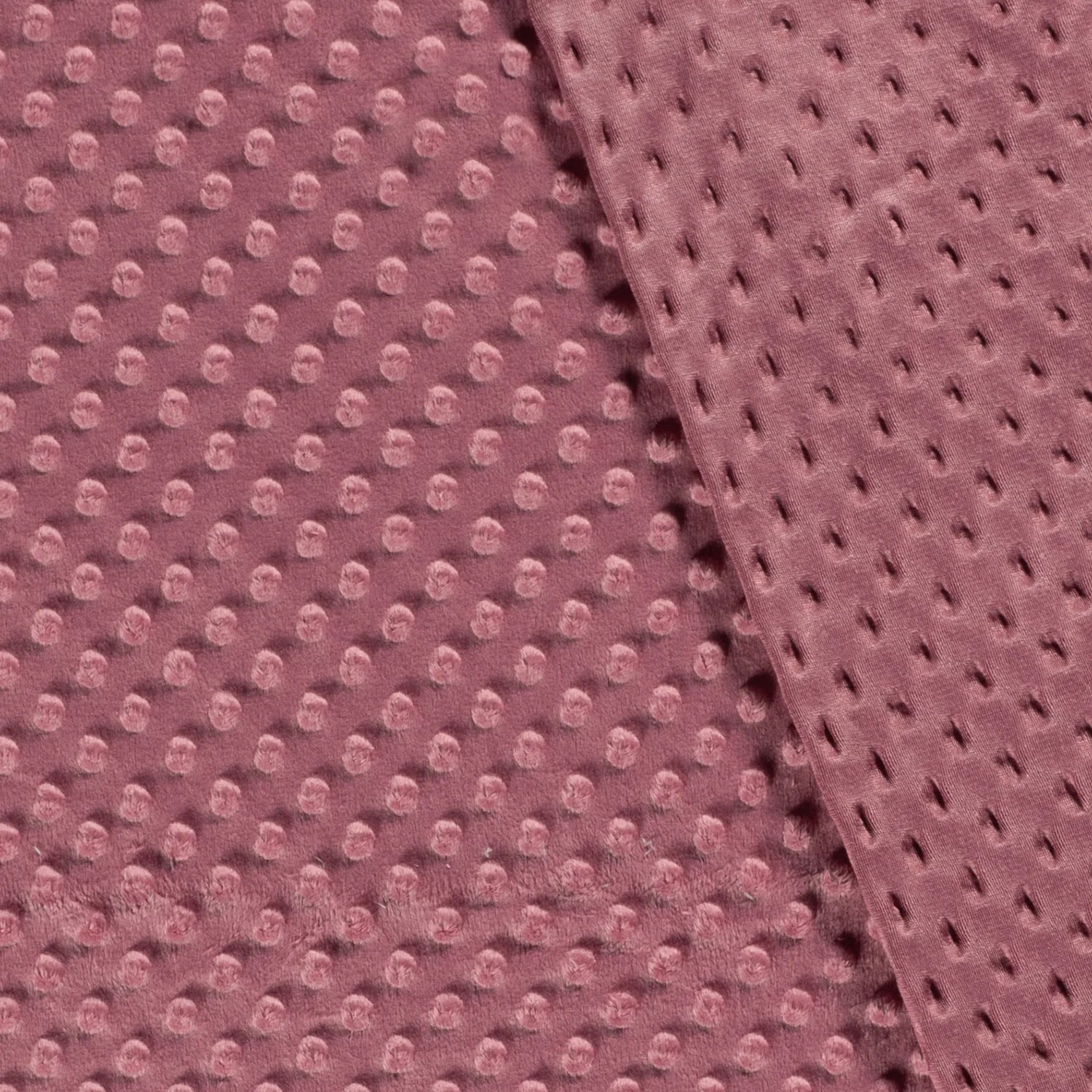 Voor- en achterkant van oudroze minky fleece met stippen