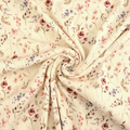 Gedrapeerde crèmekleurige rib jersey met zachte bloemenprint en fijne ribstructuur