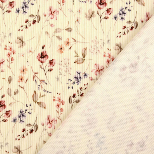 Voor- en achterzijde van crèmekleurige rib jersey met fijne bloemenprint